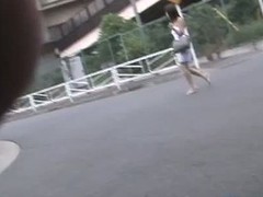 cute Japanese girl procurement top sharked on hammer away street in public